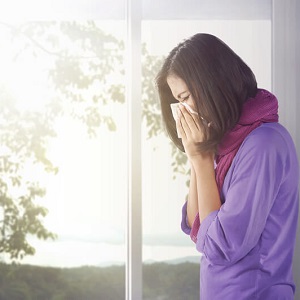 woman covering her nose