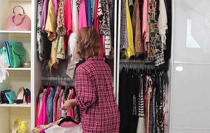 woman organizing her cabinet